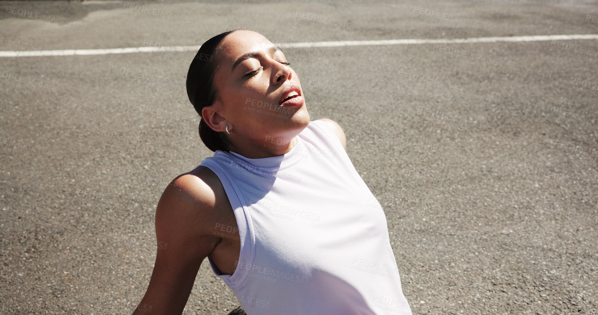 Buy stock photo Fitness, break and woman relax on ground, marathon training and outdoor exercise for wellness goal. Workout pause, morning run and athlete with space on road, cardio rest and peace from high angle