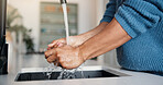 Man, water and washing hands with tap in kitchen for hygiene, disinfection or rinse in home. Self care, person or sink with faucet, health or safety for clean skin, bacteria or germ removal in house