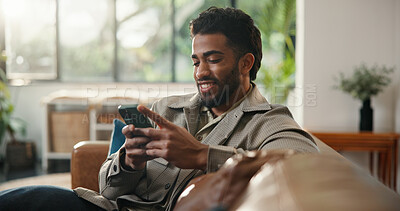 Buy stock photo Home, cellphone and man on sofa, smile and social media with communication. Smartphone, relax and happy person with email, texting and connection with network, online reading and message to contact