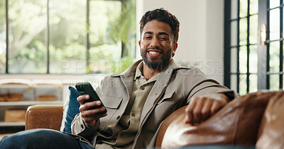 Buy stock photo Smartphone, portrait and happy man in home for relax, social media or online communication. Mobile, smile and person chill in living room with internet app, notification and connection in India