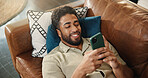 Home, above and man on couch, smartphone and online reading with communication. Cellphone, relax and person with happiness, email notification and connection with internet, app and message to contact