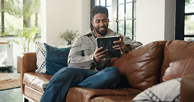 Buy stock photo Reading, ebook and man with tablet, lounge and app subscription for fiction novel, happy and online. Reader, website and person with tech for entertainment, home and relax on couch, smile or break