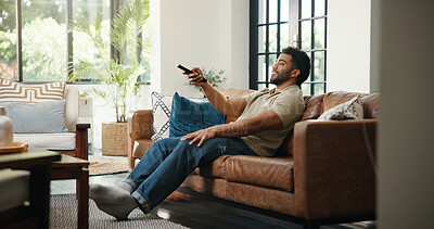 Buy stock photo Relax, watching tv and man with remote on couch, streaming subscription or movie selection choice. Press,  film website and person in home for entertainment, channel surfing or search with controller
