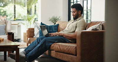 Buy stock photo Creative, typing and man with laptop, lounge and email marketing on website, online and remote work. Home, brand awareness and self publisher with tech for novel promotion, app and person on couch