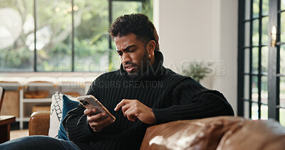 Buy stock photo Phone, confused and reading with man on sofa for phishing scam, verification error and glitch. Account hacking, cybercrime crisis and bad news with person and tech in living room in home for spam