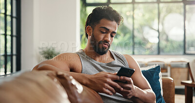 Buy stock photo Relax, reading and man with phone on couch, check social media or browsing internet for digital book. Email notification, texting or person chilling in home with mobile app, blog post or watch video