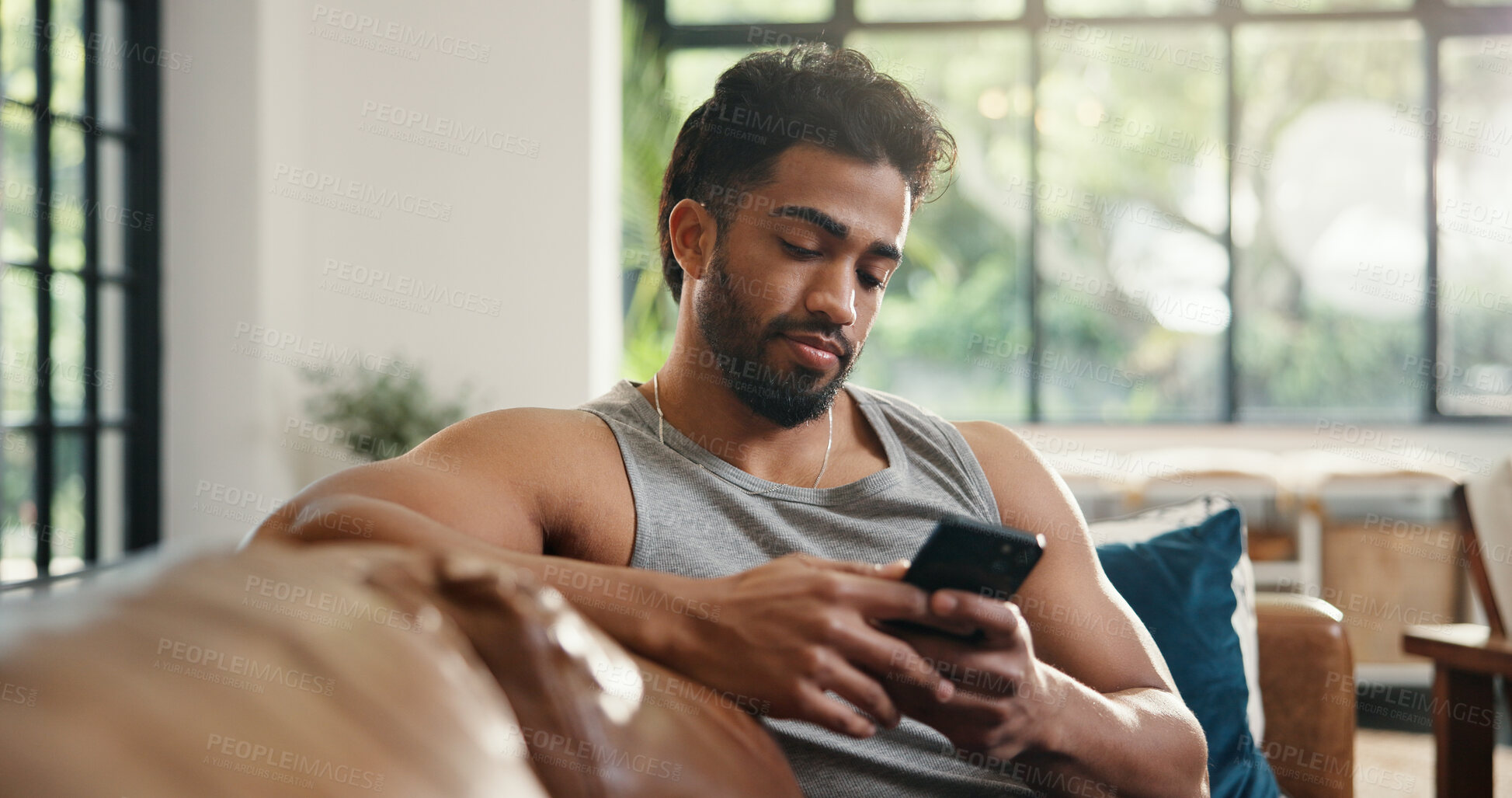 Buy stock photo Relax, reading and man with phone on couch, check social media or browsing internet for digital book. Email notification, texting or person chilling in home with mobile app, blog post or watch video