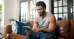 Relax, scroll or man with tablet on couch, check social media or browsing movie selection on website. Subscription service, film and person chilling in home with tech, watch video or streaming choice