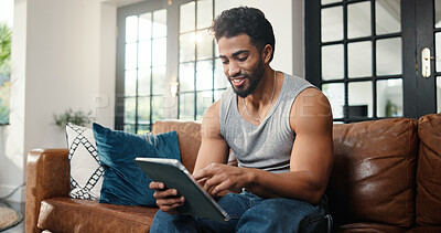 Buy stock photo Relax, scroll or man with tablet on couch, check social media or browsing movie selection on website. Subscription service, film and person chilling in home with tech, watch video or streaming choice