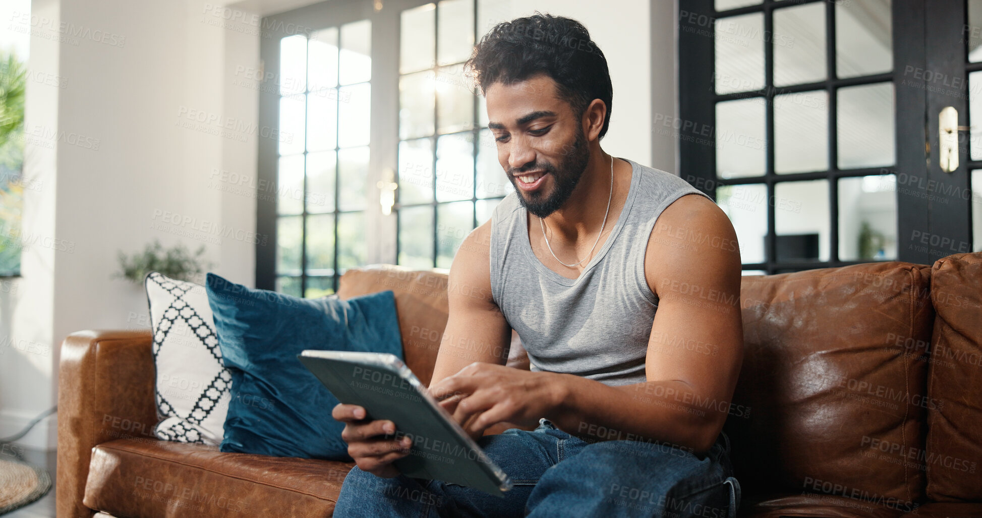 Buy stock photo Relax, scroll or man with tablet on couch, check social media or browsing movie selection on website. Subscription service, film and person chilling in home with tech, watch video or streaming choice