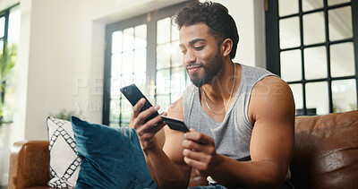 Buy stock photo Happy, man or credit card on sofa with phone, payment or Black Friday discount for online shopping. Person, typing and fintech in apartment with tech, bank transaction and eft purchase for ecommerce.