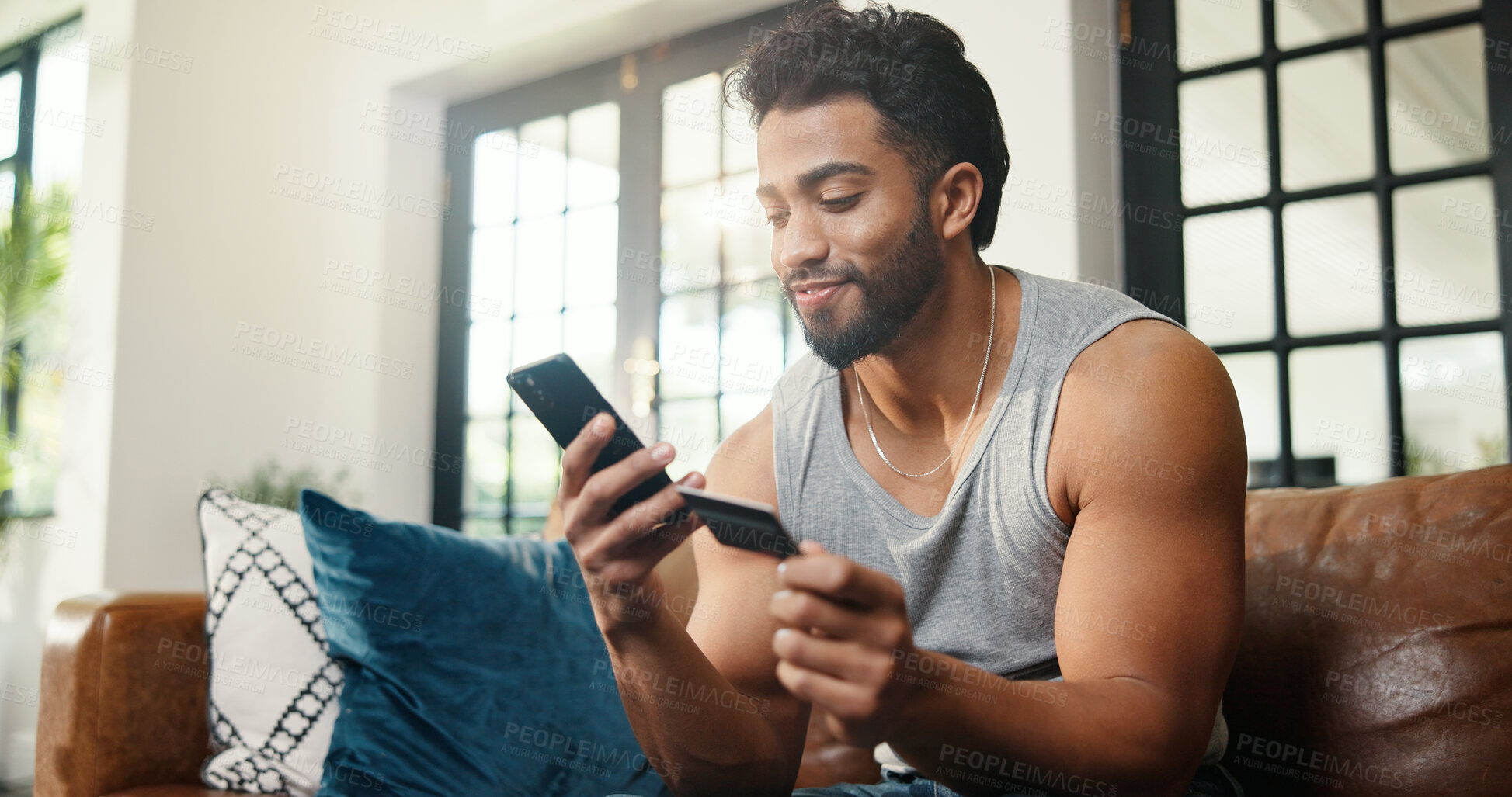Buy stock photo Happy, man or credit card on sofa with phone, payment or Black Friday discount for online shopping. Person, typing and fintech in apartment with tech, bank transaction and eft purchase for ecommerce.