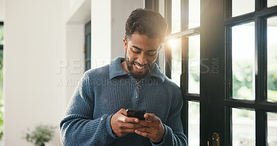 Buy stock photo Window, typing and happy man with phone, browsing internet and check social media post. Message notification, texting and person in home with mobile app, online communication and reply to comment.
