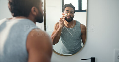 Buy stock photo Man, lotion and mirror for skincare in bathroom for hydration, healthy skin and sunscreen treatment. Male person, reflection and beauty with facial cream, collagen benefits and moisturizing at house