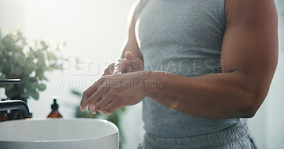 Buy stock photo Cream, hands and skincare with man in bathroom of home for daily or morning moisturizing routine. Beauty, body care and lotion with person in apartment for cosmetics, dermatology or wellness