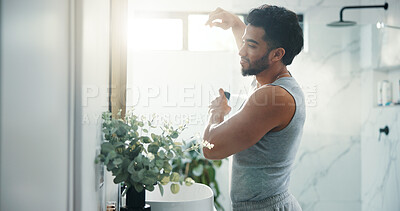 Buy stock photo Man, deodorant and spray armpit at bathroom mirror, home and smile for fragrance with flare in morning. Person, grooming and self care with scent for odor, sweat or happy with bottle at apartment
