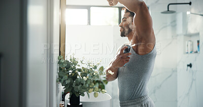 Buy stock photo Man, hygiene and spray armpit at bathroom mirror, home and smile for deodorant with flare in morning. Person, grooming and self care with fragrance for odor, sweat or happy with bottle at apartment
