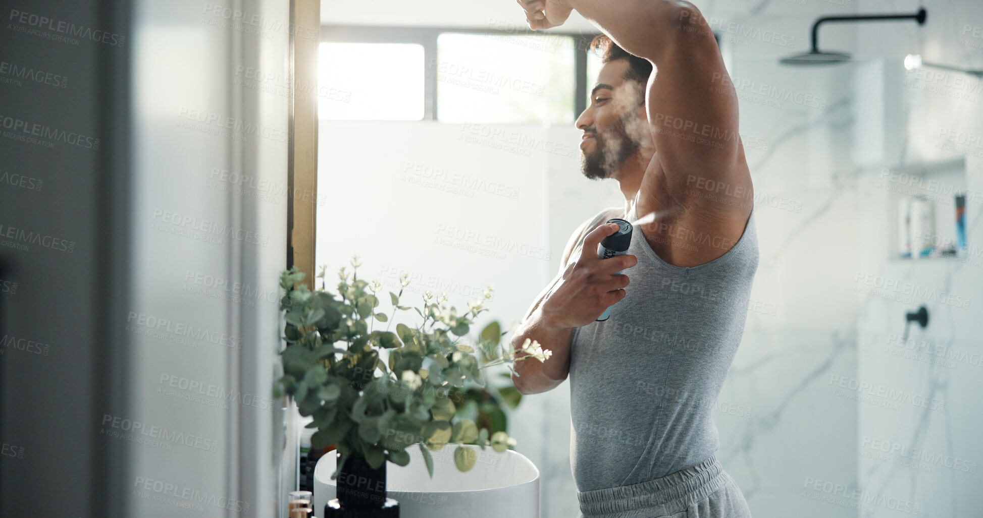 Buy stock photo Man, hygiene and spray armpit at bathroom mirror, home and smile for deodorant with flare in morning. Person, grooming and self care with fragrance for odor, sweat or happy with bottle at apartment