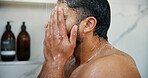 Water, grooming and man in shower in bathroom for germs, dirt or bacteria removal with body care. Hygiene, dermatology and male person washing skin for health, wellness or morning routine in home.