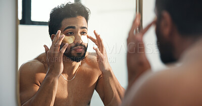 Buy stock photo Mirror, skincare and man with eye patches for beauty, facial treatment and collagen in bathroom. Reflection, person and mask for dark circles, cosmetics product and dermatology with self care in home