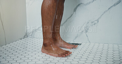 Buy stock photo Man, legs and shower in bathroom with water for cleaning, hydration and dermatology in apartment. Person, feet and washing body with liquid for skincare hygiene, wellness and morning routine in home.