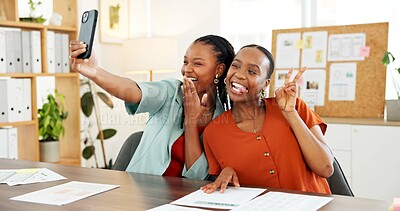 Buy stock photo Selfie, smile or black women in office with peace sign, friends or fun in workplace memory. Digital, playful or employees in agency with tongue out, collaboration or moment capture for social media.