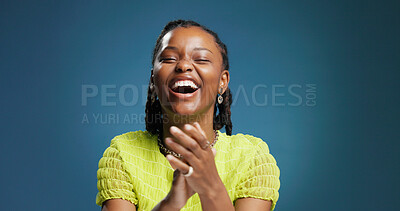 Buy stock photo Happy, black woman or winning with applause in studio for celebration on a blue background. Excited, female person or model clapping with smile or thank you for victory or achievement on mockup space