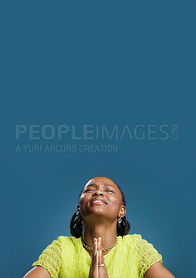 Buy stock photo Black woman, hope and prayer hands with space in studio for luck on a blue background. Female person, model or faith with desire, expectation or dream for slight chance, wish or miracle on mockup
