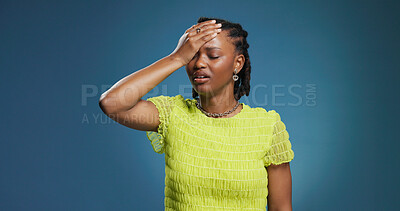 Buy stock photo Stress, burnout and black woman in studio, headache and overwhelmed on blue background. Space, migraine and African person with pain, health risk and exhausted with anxiety, tired and brain fog