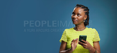 Buy stock photo Thinking, smartphone and black woman in studio, internet and connection on blue background. Mockup space, decision and African person with cellphone, contemplation or message to contact, app or email