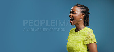 Buy stock photo Black woman, shouting and banner with space in studio for advertising on a blue background. Female person, model or screaming with expression or announcement for marketing or word of mouth on mockup