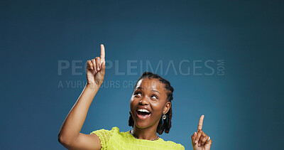 Buy stock photo Excited, pointing or black woman in studio, show announcement or advertising alert with choice info. Offer notification, mockup space or happy person with gesture for option, smile or blue background