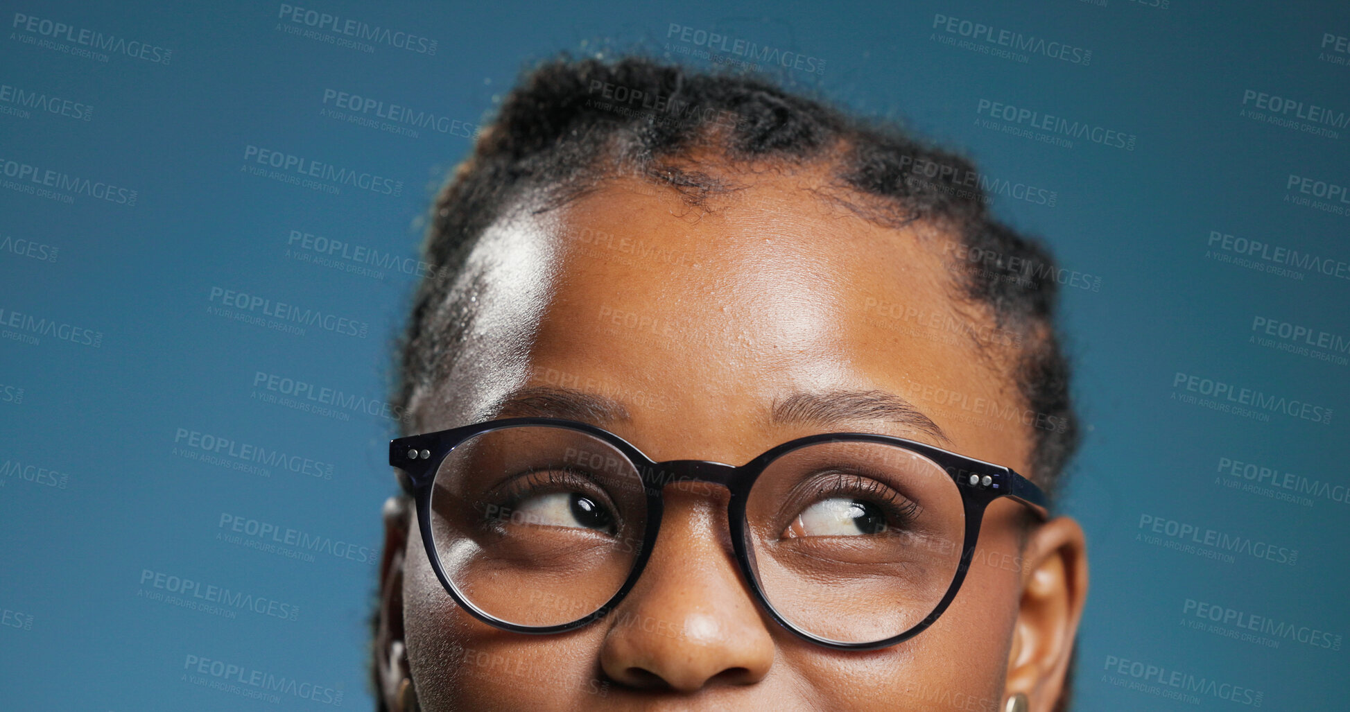 Buy stock photo Glasses, thinking and vision with black woman in studio for optometry or prescription frame lenses. Eyewear, ideas and sight with African person on blue background for ophthalmology consultation 