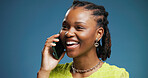 Phone call, smile and black woman in studio, communication and contact on blue background. African person, conversation and smartphone with digital app, listening and chatting with discussion or joke