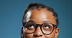 Black woman, student and thinking with glasses in studio for idea on a blue background. Thoughtful, female person or model with spectacles for problem solving, decision or choice for option or vision