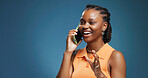 Phone call, smile and black woman in studio for communication, talk and chat on blue background. Tech, conversation and African person speaking to contact for news, gossip and story with mockup space