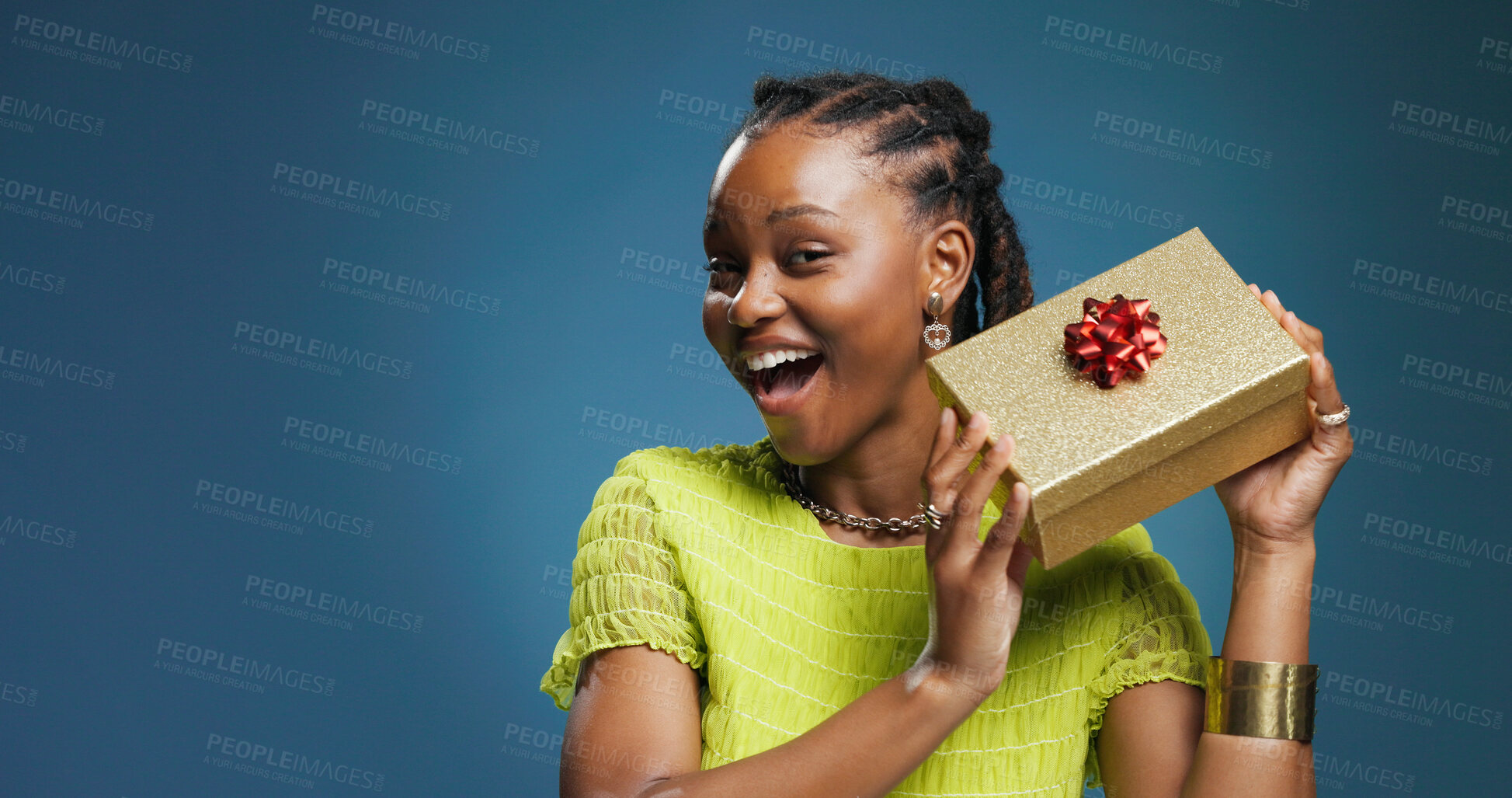 Buy stock photo Box, celebration and portrait with black woman on studio space for package or surprise gift. Present, ribbon and smile with excited African person isolated on blue background mockup for giveaway