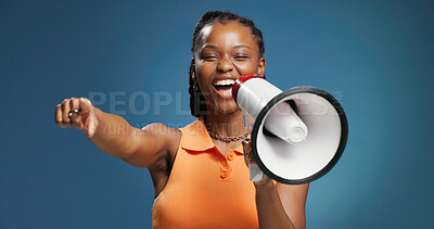 Buy stock photo Megaphone, pointing and portrait of black woman in studio for sale promotion, attention and announcement. Loud speaker, alert and notification with person and bullhorn on blue background for offer
