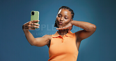 Buy stock photo Pout, selfie and social media with black woman in studio for profile picture or status update. Content creation, post and photograph with African influencer on blue background for streaming platform