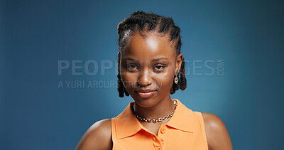 Buy stock photo Portrait, black woman and jewelry designer in studio, creative professional and space. Smile, confidence and African person with pride, jeweler and artisan with earrings on blue background in Kenya