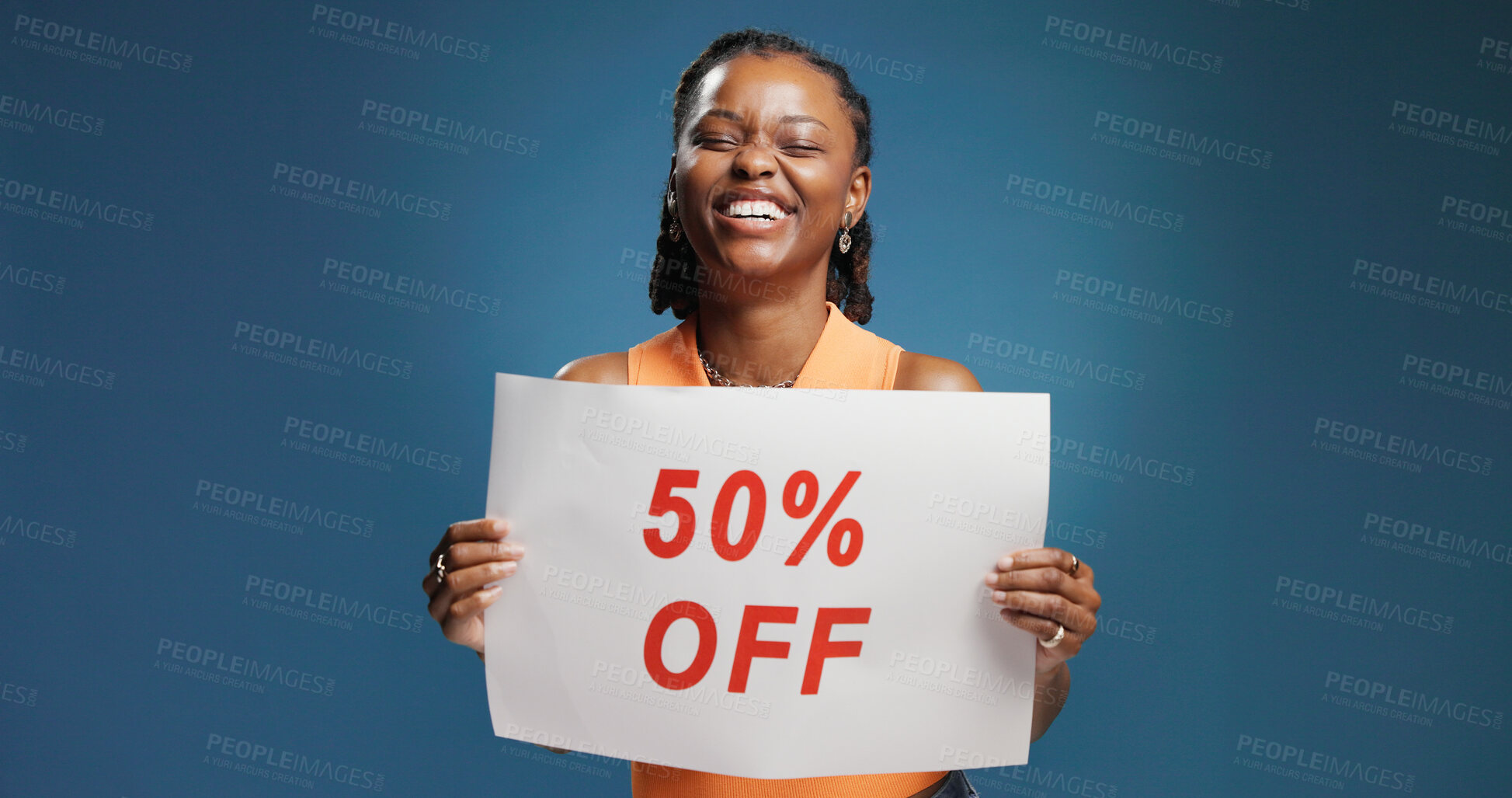 Buy stock photo Happy, black woman or discount with billboard sign for advertising on a blue studio background. Female person, promoter or African model with poster, half price or marketing offer for shopping deal