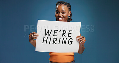 Buy stock photo We are hiring, portrait or black woman in studio with poster, position or job available in onboarding. Recruitment, space or hr on blue background with paper, offer or candidate in career opportunity