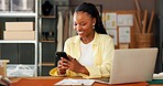 Phone, ecommerce and black woman in office for small business, fashion supply chain or online review. Logistics, mobile and happy entrepreneur with delivery update, typing email or distribution