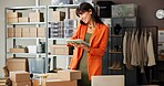 Woman, phone call and tablet at warehouse with dropshipping, order and happy for deal at company. Person, smartphone and tech with smile, ecommerce or app with boxes, fashion and storage at shop