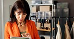 Ecommerce, clothes and woman with tablet in fashion store for stock check, online order or update. Small business owner, digital app and happy with garment for quality control or inventory management