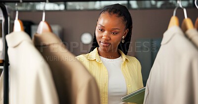 Buy stock photo Fashion, tablet and black woman in boutique with rack, checklist or inventory inspection for ecommerce. Digital, review and person with clothes, counting stock and quality assurance for distribution
