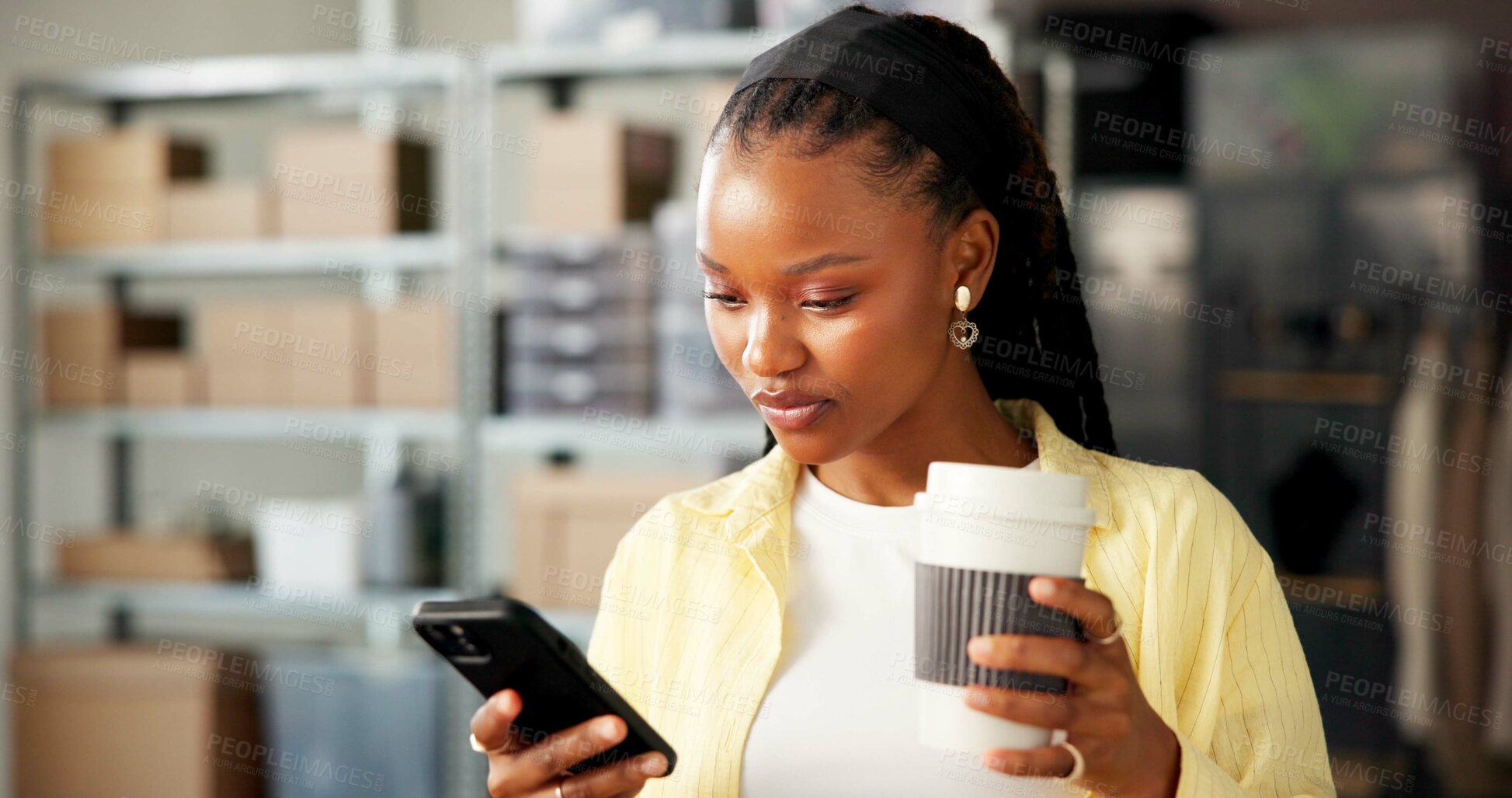 Buy stock photo Coffee, logistics and phone with black woman typing message in fashion boutique or small business. Clothing startup, communication and drink with supplier person at work for retail quality control