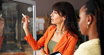 Buy stock photo Small business, glass and women writing in meeting for strategy, supply chain ideas and planning. Startup, teamwork and people with board, tablet and talking for ecommerce, supplier and logistics