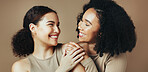 Beauty, hug and smile with women in studio together for bonding, cosmetics or dermatology.  Aesthetic, satisfaction and skincare with sisters embracing on brown background for benefits or results