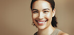 Beauty, happy and portrait of woman in studio for wellness, confidence and skincare for salon. Mockup space, dermatology and person with smile for cosmetics, glow and aesthetic on brown background